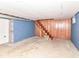 The basement features wood and concrete walls and a staircase at 18378 Southeastern Pkwy, Fortville, IN 46040