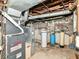 Unfinished basement utility area with water tanks and a furnace at 18378 Southeastern Pkwy, Fortville, IN 46040