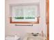 Classic bathroom features a tiled sink and window at 18378 Southeastern Pkwy, Fortville, IN 46040
