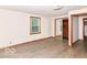 Bedroom featuring windows, hardwood floors, and closet at 18378 Southeastern Pkwy, Fortville, IN 46040