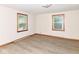Bright bedroom with light-colored walls, wooden trim, and new laminate flooring at 18378 Southeastern Pkwy, Fortville, IN 46040