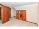 Cozy bedroom features a built-in storage unit and plush carpeting, adding warmth and comfort at 18378 Southeastern Pkwy, Fortville, IN 46040