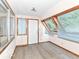 Sunny bonus room with plenty of natural light from the windows and wood trim at 18378 Southeastern Pkwy, Fortville, IN 46040