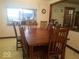 Spacious dining room with a large wooden table and ample seating for gatherings at 18378 Southeastern Pkwy, Fortville, IN 46040