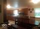 Kitchen and dining area with wooden cabinetry and ample storage space at 18378 Southeastern Pkwy, Fortville, IN 46040