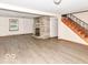 Living room featuring a stone fireplace and hardwood floors at 18378 Southeastern Pkwy, Fortville, IN 46040