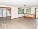 Open-concept living room with light wood floors and lots of natural light at 18378 Southeastern Pkwy, Fortville, IN 46040