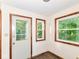 Bright sun room featuring large windows and an exterior door at 18378 Southeastern Pkwy, Fortville, IN 46040