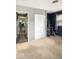 Bedroom with blue accent wall, carpet and an open closet at 205 Eikenberry St, Greenfield, IN 46140