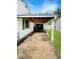 Covered carport providing sheltered parking and convenient access to the home's side entrance at 205 Eikenberry St, Greenfield, IN 46140