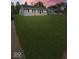 Single-story home with a well-manicured lawn and easy access to nearby neighborhood amenities at 205 Eikenberry St, Greenfield, IN 46140