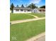 Well-maintained lawn with convenient sidewalk access to front door of nearby single Gathering home at 205 Eikenberry St, Greenfield, IN 46140