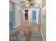 A long hallway with multiple doors leads to several rooms in the home at 205 Eikenberry St, Greenfield, IN 46140