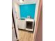 Featuring a full-sized washer and dryer set, this room has bright walls and a functional layout at 205 Eikenberry St, Greenfield, IN 46140