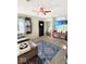 Cozy living room featuring a comfortable sofa, stylish rug, and a ceiling fan at 205 Eikenberry St, Greenfield, IN 46140
