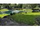 This amazing property features a large pond with a fountain and lush greenery, creating a serene and picturesque outdoor space at 2083 Kerns Ct, Carmel, IN 46280