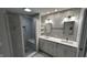 Bright bathroom featuring a double vanity with white cabinets, a large tiled shower, and modern lighting at 2083 Kerns Ct, Carmel, IN 46280