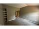 Neutral-toned bedroom with carpeted floors, a built-in shelf and ample natural light, perfect for relaxing at 2083 Kerns Ct, Carmel, IN 46280