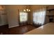 Cozy dining room featuring a chandelier, large window, and view into the kitchen, great for Gathering meals at 2083 Kerns Ct, Carmel, IN 46280