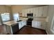 Stylish kitchen with white cabinets, stainless steel appliances, and a center island, ideal for cooking and entertaining at 2083 Kerns Ct, Carmel, IN 46280