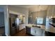 Contemporary kitchen boasting stainless steel appliances, white cabinets, and a large island at 2083 Kerns Ct, Carmel, IN 46280