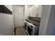Well organized laundry room featuring white cabinets and counter space above the washer and dryer at 2083 Kerns Ct, Carmel, IN 46280