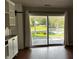 Picture of living room looking onto a screened-in porch with views of the pond, merging indoor and outdoor living at 2083 Kerns Ct, Carmel, IN 46280