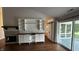 Bright living room with a fireplace, built-in shelving and access to an outdoor patio through sliding glass doors at 2083 Kerns Ct, Carmel, IN 46280