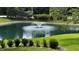 Picture of a beautiful pond with a fountain surrounded by manicured lawns and shrubbery creating a serene outdoor retreat at 2083 Kerns Ct, Carmel, IN 46280