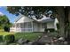 This lovely home features a screened porch and stone walkway, set in a beautiful yard, perfect for relaxing outdoors at 2083 Kerns Ct, Carmel, IN 46280