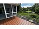 Screened-in porch with a view of the pond, stepping stones, and lush landscaping at 2083 Kerns Ct, Carmel, IN 46280