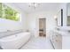 Inviting bathroom with freestanding tub, marble accents, and modern fixtures at 2130 Brookside Pkwy N Dr, Indianapolis, IN 46201