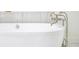 Close up shot of a bathtub with silver faucet and fixtures at 2130 Brookside Pkwy N Dr, Indianapolis, IN 46201