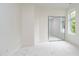 Bright bedroom with plush carpeting, large window, and mirrored closet at 2130 Brookside Pkwy N Dr, Indianapolis, IN 46201