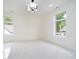 Bright bedroom with a modern chandelier, multiple windows, and soft carpet flooring at 2130 Brookside Pkwy N Dr, Indianapolis, IN 46201
