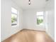 Bright and airy bedroom features hardwood floors, large windows, and modern design at 2130 Brookside Pkwy N Dr, Indianapolis, IN 46201
