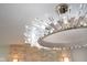 Elegant crystal chandelier with reflective accents and bright lighting at 2130 Brookside Pkwy N Dr, Indianapolis, IN 46201
