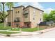 This unique house features brick accents, tan siding, and stylish outdoor seating at 2130 Brookside Pkwy N Dr, Indianapolis, IN 46201