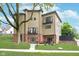 Modern three-story home with balconies, brick accents, and a well-maintained lawn at 2130 Brookside Pkwy N Dr, Indianapolis, IN 46201