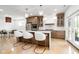 Gourmet kitchen with stainless steel appliances, a center island, and stylish pendant lighting at 2130 Brookside Pkwy N Dr, Indianapolis, IN 46201