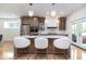 Beautiful kitchen with stainless steel appliances, marble island, and a breakfast bar at 2130 Brookside Pkwy N Dr, Indianapolis, IN 46201