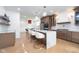 Kitchen with marble island, stainless steel appliances, and hardwood flooring at 2130 Brookside Pkwy N Dr, Indianapolis, IN 46201