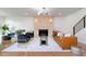 Bright living room with a stone fireplace, stylish seating, and a modern aesthetic at 2130 Brookside Pkwy N Dr, Indianapolis, IN 46201