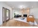 Bright living room features hardwood floors, a stone fireplace, and stylish modern furnishings at 2130 Brookside Pkwy N Dr, Indianapolis, IN 46201