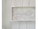Shower detail showcasing elegant marble shelf niche, for storage at 2130 Brookside Pkwy N Dr, Indianapolis, IN 46201