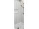 Modern shower featuring marble-look tile with stylish fixtures and drain at 2130 Brookside Pkwy N Dr, Indianapolis, IN 46201