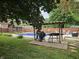 Backyard featuring a pool, barbeque, shed, fenced in yard, and outdoor seating at 2239 Chevelle Ct, Anderson, IN 46012