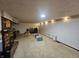 This basement is spacious and cozy, featuring carpet, a fireplace, and comfortable seating, ideal for entertaining at 2239 Chevelle Ct, Anderson, IN 46012