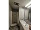 This bathroom features a shower with glass door, vanity, sink and large mirror at 2239 Chevelle Ct, Anderson, IN 46012