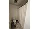 This bathroom features a toilet, shower curtain and towel rack at 2239 Chevelle Ct, Anderson, IN 46012